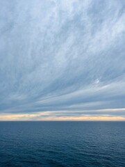 Cloudy sky at the sea horizon, dark cloudy sky at the seascape, sunset time