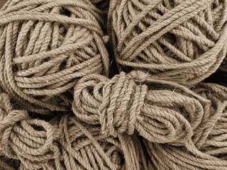 Tangled coarse linen ropes. Texture for the background. Selective focus