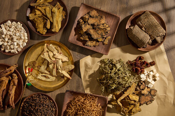Concept of healthy life with many types of traditional Chinese medicine arranged on many wooden...