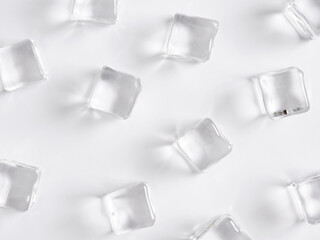 Transparent ice cubes on white background.