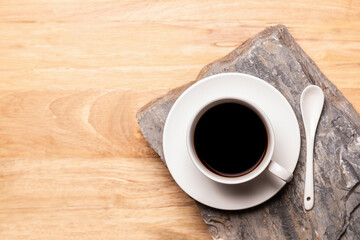  Black coffee in coffee cup on wooden table