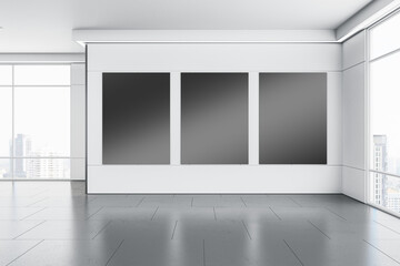 Modern gallery interior with clean black mock up banners on white concrete wall, flooring with reflections and window with city view and daylight. 3D Rendering.