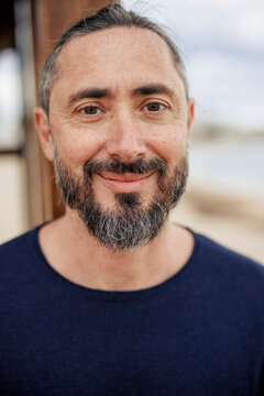 Happy Man Wearing Blue T-shirt At Beach