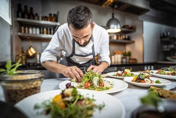 Gordijnen Photo of a chef cooking in a restaurant kitchen, salad © OpticalDesign