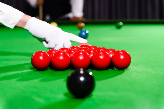 Close-up Hand of Snooker Referee while Arranging Pink Ball At The Beginning Game.