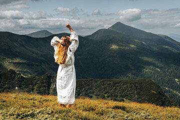 A girl in an embroidered dress on the highest ridge of Ukraine - Chornohirskyi.