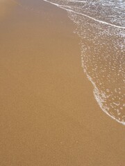 wet sand at the sea coast, natural sea sand texture