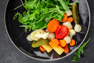 vegetable pickled salad cucumber, gherkin, carrot, onion, cauliflower, pepper appetizer meal food snack on the table copy space food background rustic top view