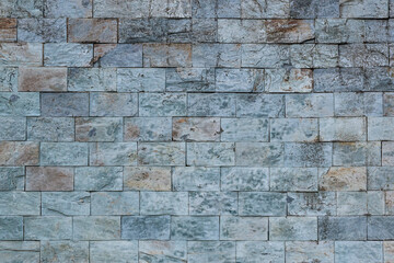 Detail of wall cladding with split stone texture
