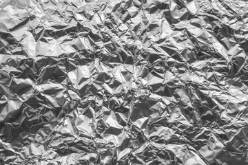 Shiny metal silver gray foil crumpled texture background