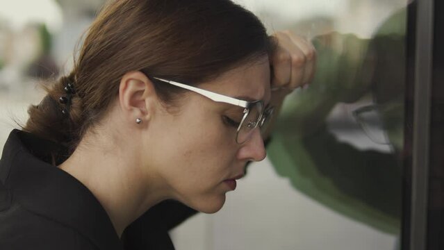 Lonely woman leaning on building wall, shocked and confused knowing bad news about some relatives death or illness, macro face close-up