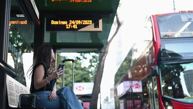 woman in the city, waiting fot the shuttle