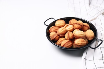 Nuts cookies on the table in a black bowl