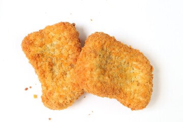 Chicken nuget is served on a plate with a white background