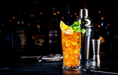 Boston tea cocktail drink with rum, gin, vodka, tequila, liquor, lemon juice, cola and ice in...