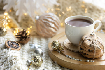 Winter composition with a cup of cocoa and chocolate cookies.