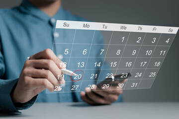 Work organization concept. Businessman checking agenda planner on digital calendar, schedule, plan,...