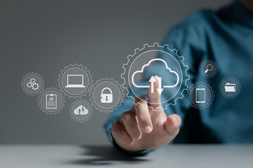 Cloud technology concept. Businessman shows cloud storage network technology icon, large network of backup platforms, online data storage for business networks with cyber security software.