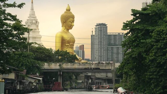 The giant buddha statue at the Wat Paknam Phasi Charoen temple in Bangkok, Thailand. Famous buddhist and the peaceful beauty in Bangkok, Thailand