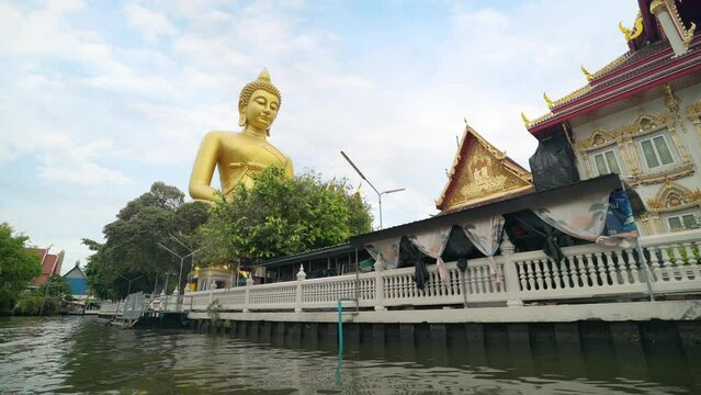 The giant buddha statue at the Wat Paknam Phasi Charoen temple in Bangkok, Thailand. Famous buddhist and the peaceful beauty in Bangkok, Thailand