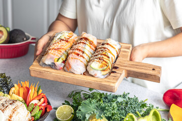 Group of spring rolls with rice paper filled with vegetables.