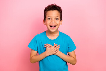Photo portrait of pretty schoolboy excited grateful touch chest dressed stylish blue outfit...