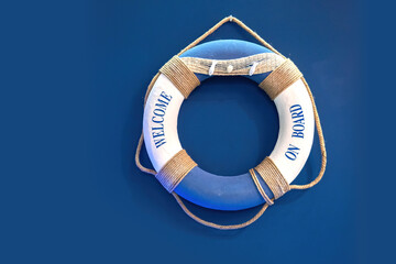 Lifebuoy on ship. Welcome on board. Lifebuoy to help drowning people. Inflatable ring to protect...