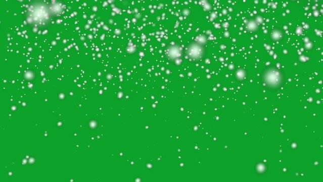 Snow falling down slowly 4K animation on Green screen. Christmas falling snow. Snowfall in holidays on chroma key background.