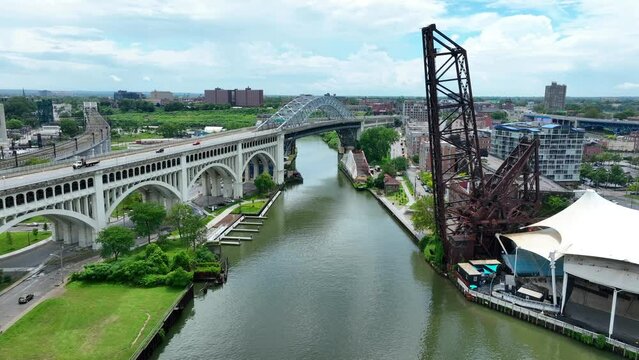 B and O Railroad Bridge 463. Aerial establishing shot of old train bridge over Cuyahoga River in Cleveland, Ohio on summer day.