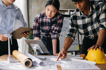 Engineer teams meeting working together wear worker helmets hardhat on construction site in modern...