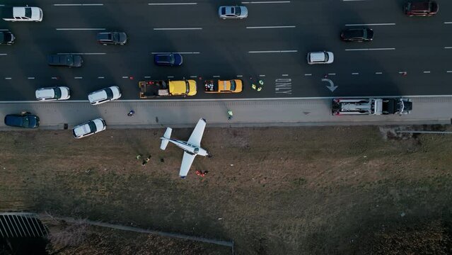 Emergency airplane landing on highway. Wide Drone shot