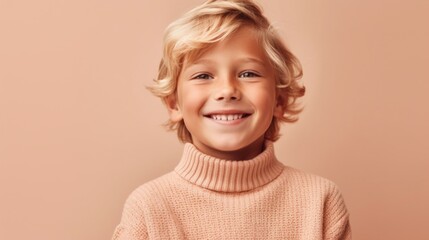 The serene beige studio background frames the radiant smile of a blond boy, creating a charming picture.