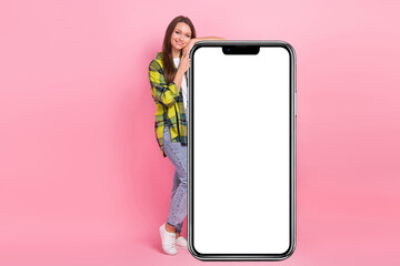 Full length photo of beautiful girl wear casual trendy look hands over big smartphone display...