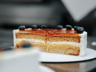 Cake section with caramel and berries in a close-up 
