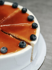 Cakes with caramel and blueberries, cut into pieces, close-up