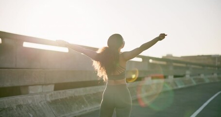 Woman, runner and winner with sport, fitness and celebration with success of outdoor exercise. Healthy, female athlete and motivation for performance, workout and mindset on trophy, reward and goal