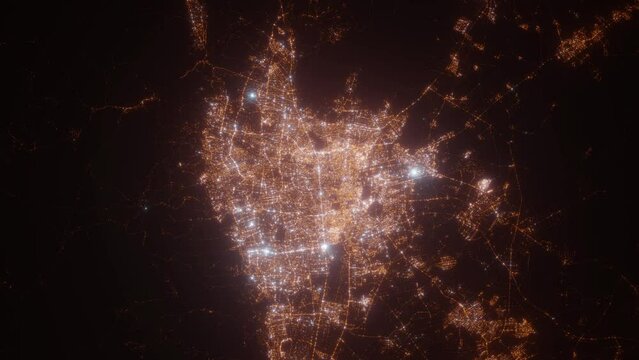 Tehran (Iran) aerial view at night. Top view on modern city with street lights. Camera is zooming out, rotating counterclockwise. Vertical video. The north is on the left side