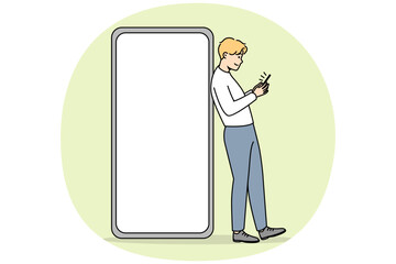 Fototapeta na wymiar Young man standing near huge smartphone with mockup screen. Guy pose near cellphone with empty blank copy space display. Vector illustration.