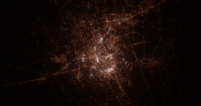 Las Cruces (New Mexico, USA) aerial view at night. View on modern city from space. Camera is zooming in, rotating counterclockwise