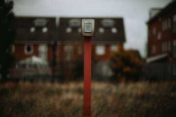 Rusty homophone on a metallic stick outdoors
