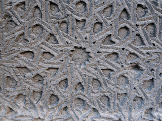 stone carving pattern from the wall of the historical stone mosque