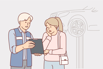 Auto mechanic showing repair cost to shocked woman client while standing in garage with car