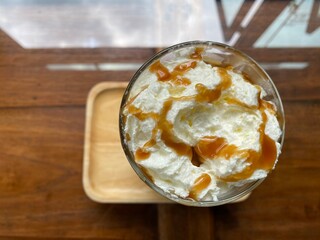 Ice Coffee with Milk foam and caramel. Photo for coffee shop or cafe