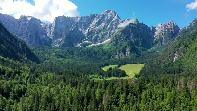 Lake of Fusine (Lago Superiore di Fusine) and the Mountain Range of Mount Mangart, Julian Alps, Tarvisio, Udine province, Friuli Venezia Giulia, Italy, Europe. Picturesque lake Lago Fusine in Italy.