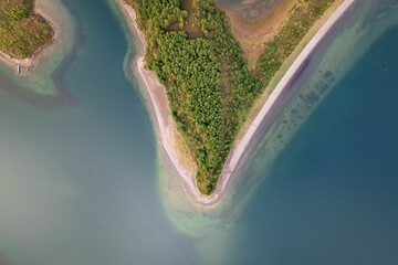 Aerial view of a picturesque bay with a gently curving shoreline