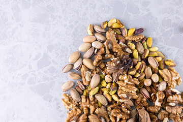 concept of pistachios and walnuts on countertop