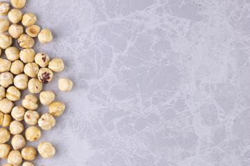 Background useable nuts standing on the edge of the marble counter