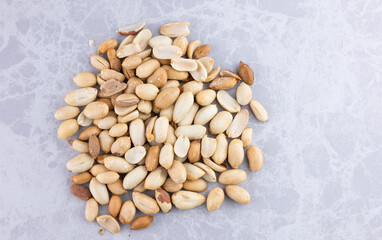 Peanuts standing in a circle on the marble countertop