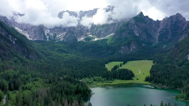 Lake of Fusine (Lago Superiore di Fusine) and the Mountain Range of Mount Mangart, Julian Alps, Tarvisio, Udine province, Friuli Venezia Giulia, Italy, Europe. Picturesque lake Lago Fusine in Italy.