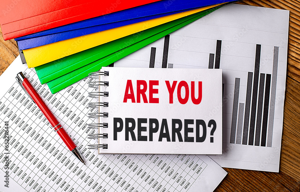 Aufkleber are you prepared text on notebook with pen, folder on a chart background